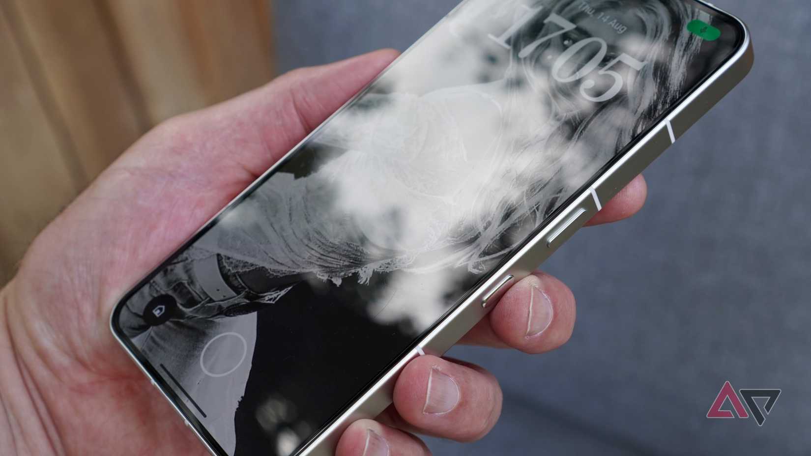 A person pressing the Nothing Phone 3's Essential Key