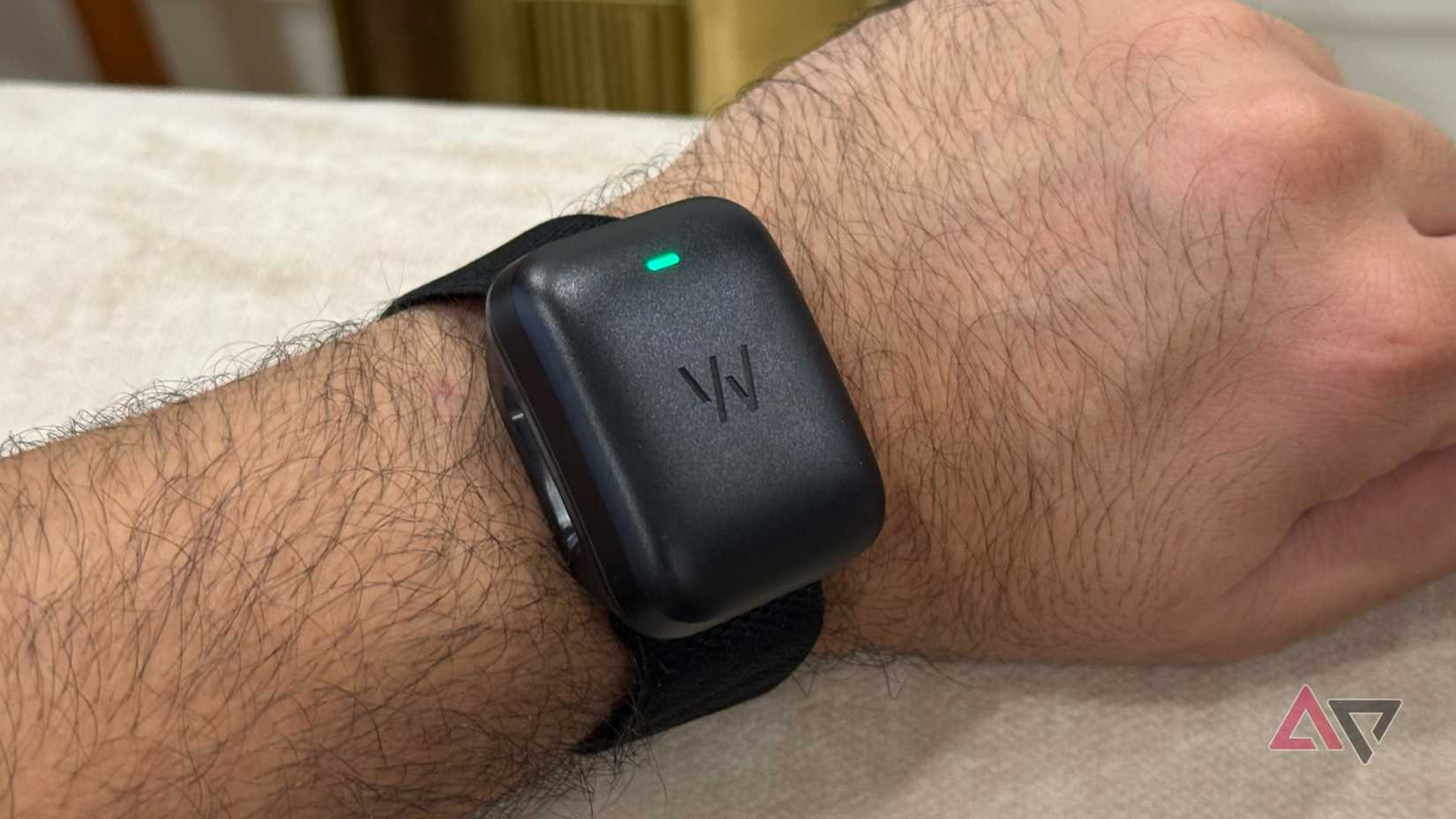 Whoop MG with the wireless charger on it